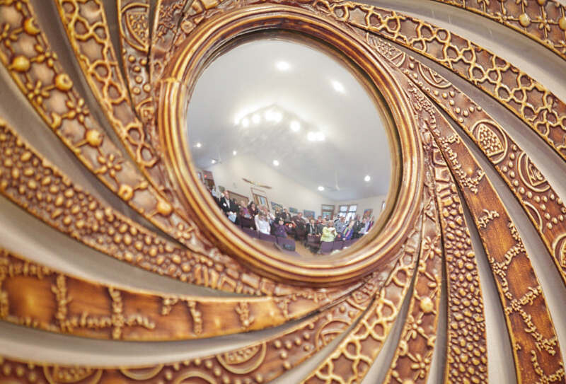 sprial mirror showing people in the sanctuary